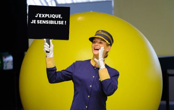 a woman holding a sign